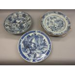 Three large Chinese blue and white chargers and a large Canton famille rose octagonal charger (all