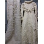 Box containing a fur trimmed wedding dress with detachable train (at fault),