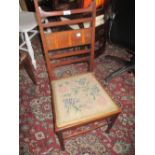 Art Nouveau mahogany inlaid low seat nursing chair on square tapering shaped supports