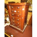 Table top mahogany chest of six drawers with knob handles,