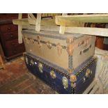 Early 20th Century brown travel trunk with original travel label and a blue canvas covered travel