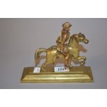 Brass figure of a huntsman on horseback