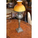 20th Century brass Corinthian column oil lamp with brass well and yellow glass shade (at fault)