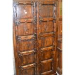 Antique and later tropical hardwood two door cupboard with iron mounts