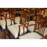 Set of six 20th Century mahogany splat back elbow chairs raised on square tapering supports with