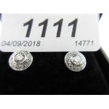 Pair of 18ct white gold diamond earrings, approximately 0.