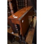 Small Edwardian walnut drop-leaf Sutherland table on turned supports together with an Edwardian