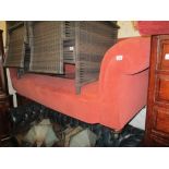 Late 19th / early 20th Century pink velour upholstered three seater sofa raised on bun feet