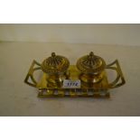 Brass ink / pen stand having two wells with glass liners,