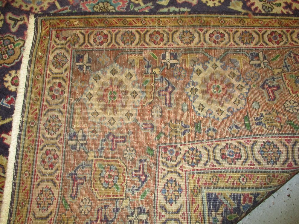 Tabriz carpet with an all-over stylised flower head design on a midnight blue ground with borders, - Image 3 of 5