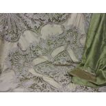 Vintage crochet work bedspread on green fabric backing together with a ladies evening purse