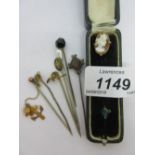 9ct Gold horseshoe stick pin together with a cameo set stick pin in case and six other stick pins