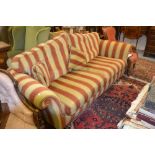 Modern upholstered Duresta three seater sofa raised on turned mahogany supports with brass casters