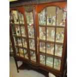 Edwardian mahogany display cabinet, the moulded cornice above an anthemion frieze,