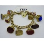 9ct Gold curb link bracelet with ten various 9ct gold mounted seals and charms