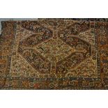 Antique South West Persian rug with a triple pole medallion and all-over stylised design with a