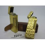 Dunhill gold plated cigarette lighter with original leather cover,