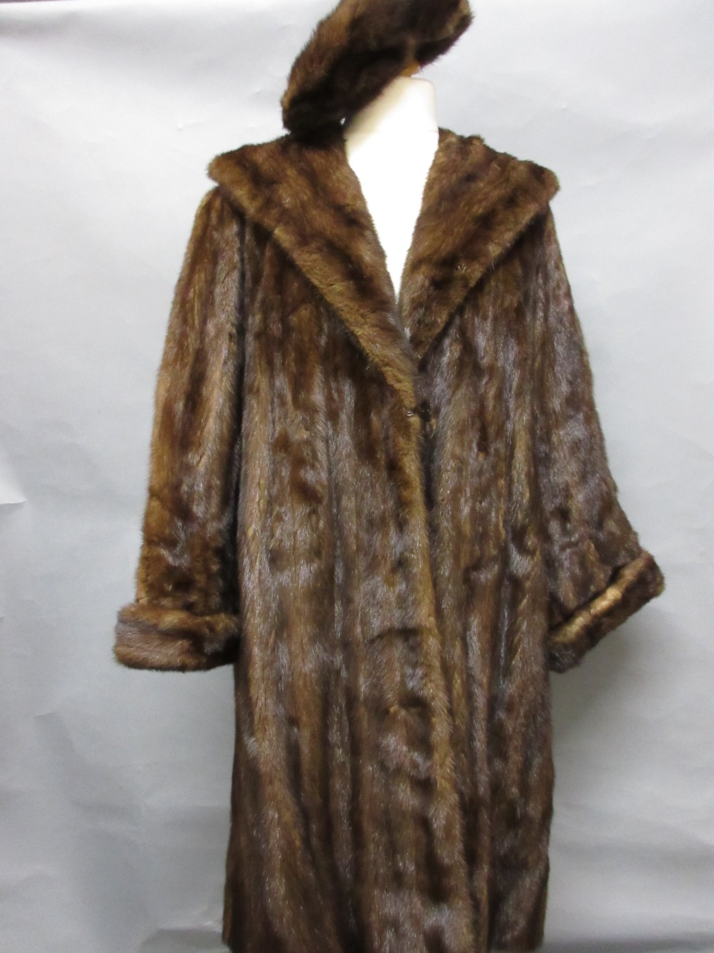 Ladies three quarter length mink fur coat with beret and gloves,
