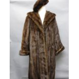 Ladies three quarter length mink fur coat with beret and gloves,
