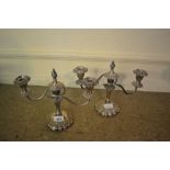 Pair of embossed silver plated three branch candelabra