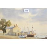 20th Century watercolour, moored coastal fishing boats at low tide, indistinctly signed,