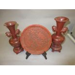 Chinese red cinnabar shallow dish together with a pair of carved soapstone vases