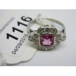 Diamond and pink sapphire dress ring, the central cushion cut sapphire of approximately 0.