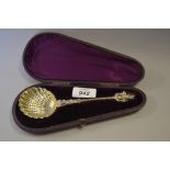 Cased Victorian silver sifter spoon with figural handle