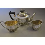 Walker & Hall three piece silver half fluted design bachelor tea service, Sheffield,