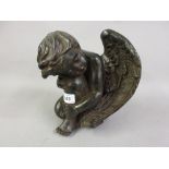 20th Century painted composition figure of a crouching cherub