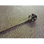 Late 19th or early 20th Century rose cut diamond and pink ruby set horseshoe design stick pin
