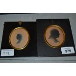 Two 19th Century oval silhouette portrait pictures of gentlemen housed in rectangular papier mache