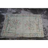 Large Chinese carpet with floral designs on a pale green ground, 24ft x 14.