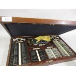 Late 19th / early 20th Century opticians mahogany cased testing set,