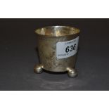 Small antique German engraved white metal toasting cup on three ball feet