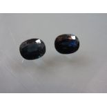 Two dark sapphire cut stones (unmounted)