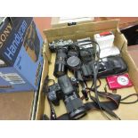 Olympus OM1 35mm camera, a Sony SLR digital camera, various lenses,