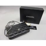 Small Chanel black quilted cross body handbag with authenticity card and original felt protector