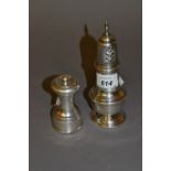 Chester silver circular baluster form pedestal sugar caster and a London silver pepper grinder