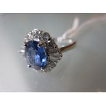 Good quality 18ct white gold sapphire and diamond cluster ring, the sapphire approximately 2.