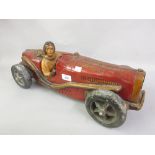Late 20th Century painted resin model of an early racing car with figure