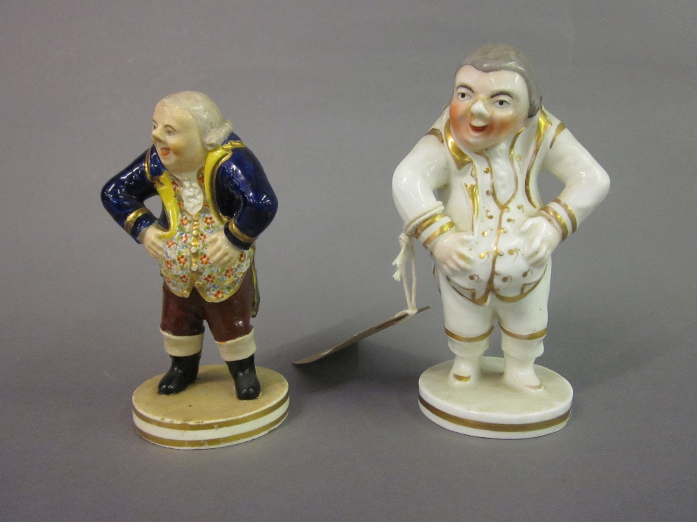 Bloor Derby figure of a portly man wearing a floral waistcoat and blue tail coat,