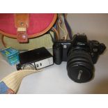 Canon EOS 500 SLR film camera with 35 - 80mm lens and other accessories