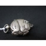 Unusual (925 standard) silver sovereign case in the form of a pig with ring loop