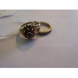 9ct Gold garnet set cluster ring and a 9ct gold eternity ring