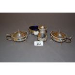 Walker and Hall London silver four piece condiment set of oval baluster form with gadroon rims
