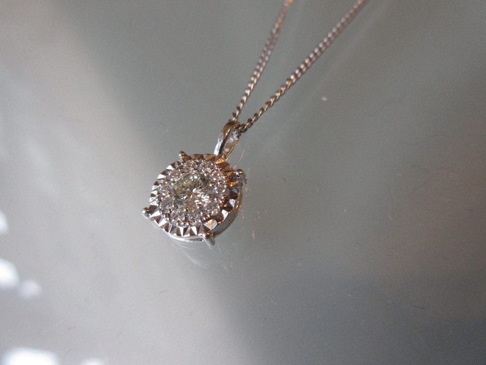 18ct White gold diamond pendant on a 9ct white gold chain