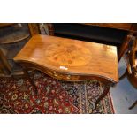 George III mahogany marquetry and line inlaid serpentine fronted fold-over card table raised on
