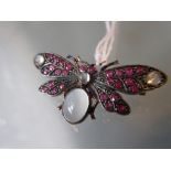 Moonstone and ruby diamond set moth brooch