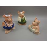 Group of three Wade National Westminster pig money boxes